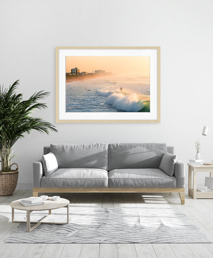 modern coastal decor featuring framed golden wave surf print