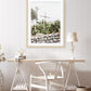 coastal decor featuring neutral, minimal print with cross and cactus. Photograph taken in Santorini Greece