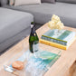 modern coastal coffee table decor with ocean photograph on clear acrylic serving tray