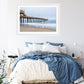 blue bedroom decor featuring framed blue pier wall art photograph by Wright and Roam
