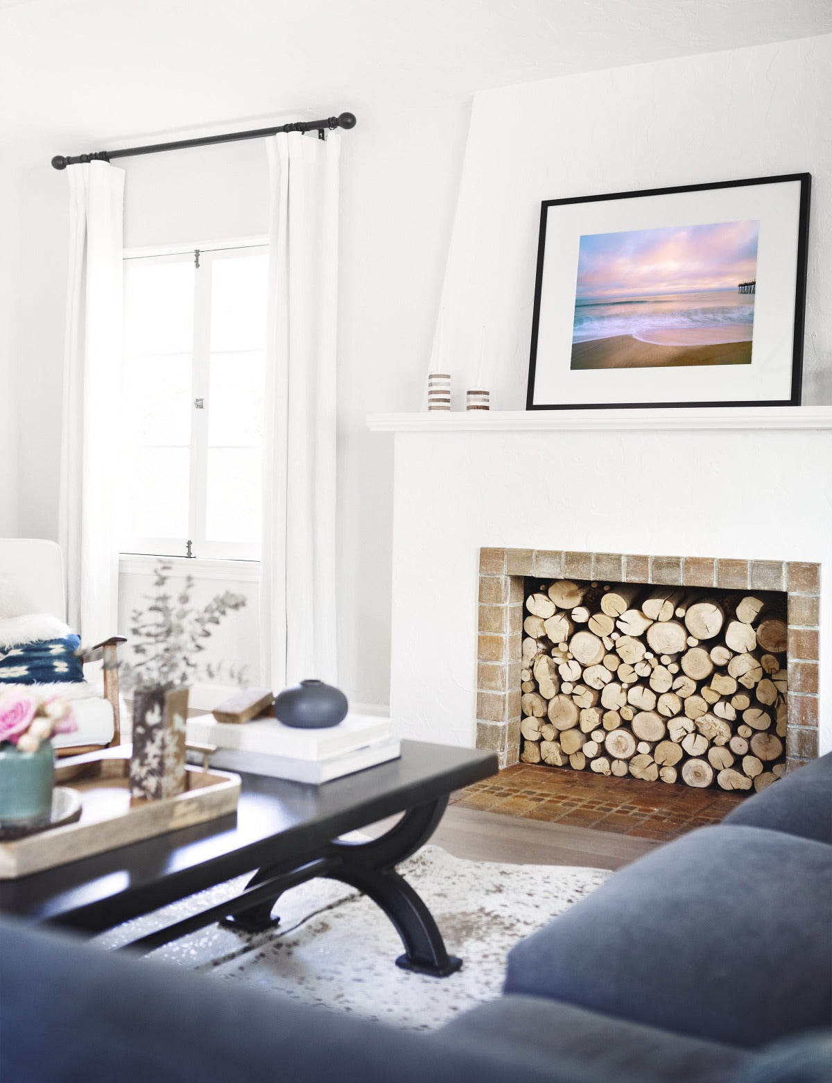 Modern living room decor featuring sunrise beach print by Wright and Roam