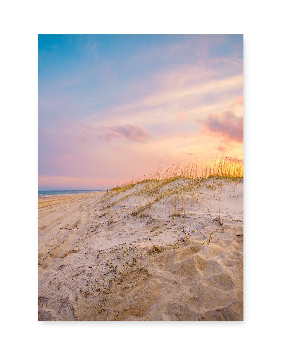 colorful sunset over sand dunes north carolina