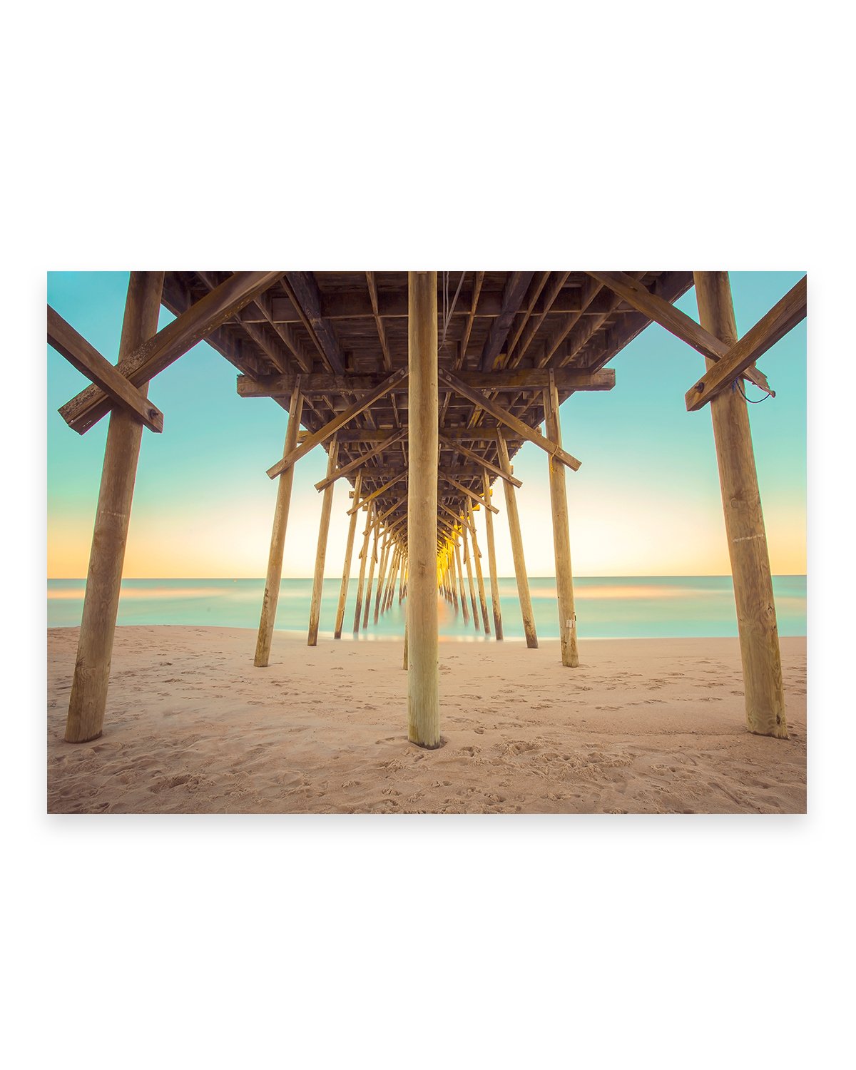 colorful pier blue and yellow sunset Carolina beach photograph by Wright and Roam