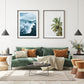 eclectic, modern living room featuring two minimalist tropical beach photographs with black frames