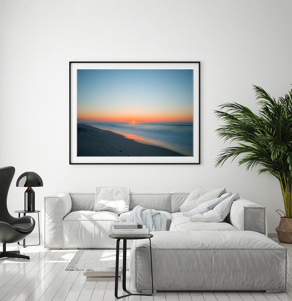 modern living room decor, grey couch, large blue sunrise beach print by Wright and Roam