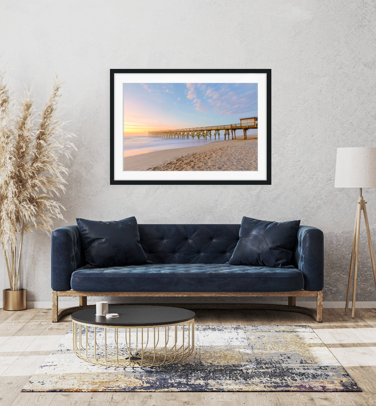 modern boho living room decor featuring framed beach print