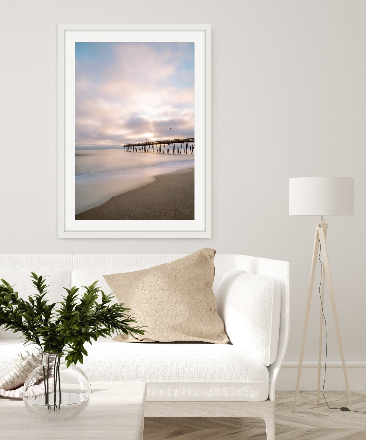 modern living room decor featuring calming beach wall art photograph framed by Wright and Roam