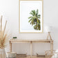 boho, coastal entryway decor featuring large palm tree photograph with wood frame